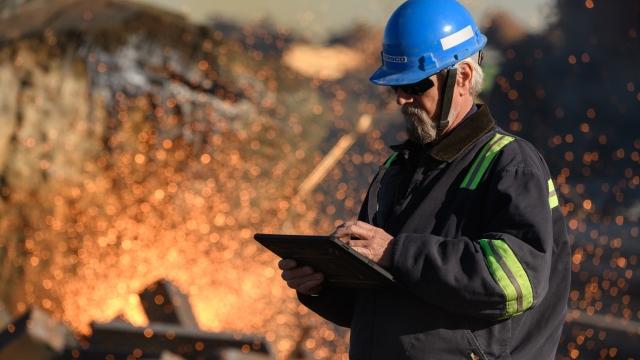 construction worker on tablet